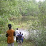 Cousins looking over Grandma and Granddaddy's pond Cousins at the pond