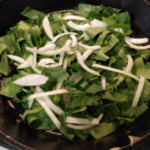 Cut up collards with onions Cut up collards with onions