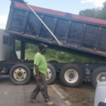 Dumping Crushed Rock over driveway entry