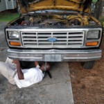 Mr. Green Thumb Under Truck