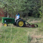 Ju riding with Mr. Green Thumb